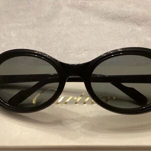 Cartier Woman’s Black Oval Sunglasses with Dark black Lenses Gold Accents 130 MM